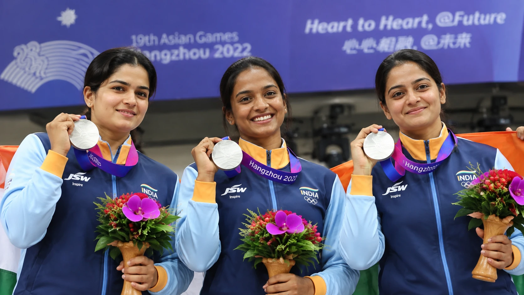 Vidarsha K Vinod with Elavenil Valarivan and Sonam Maskar after winning silver at the Asian Games 2026.